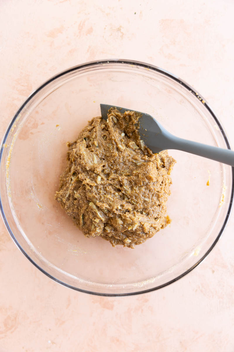 Almond flour zucchini muffin batter in a mixing bowl.