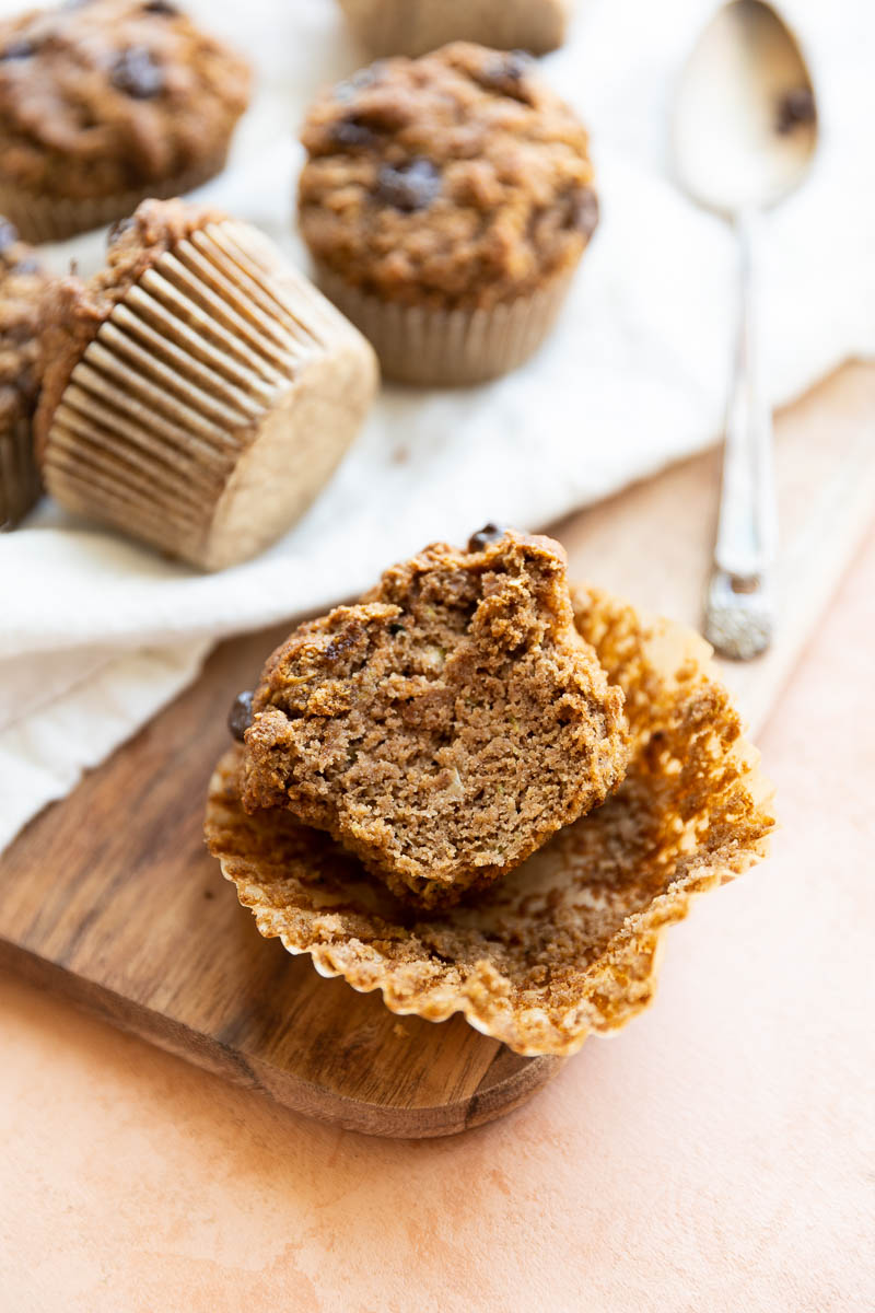 Zucchini muffin with a big bite taken out.