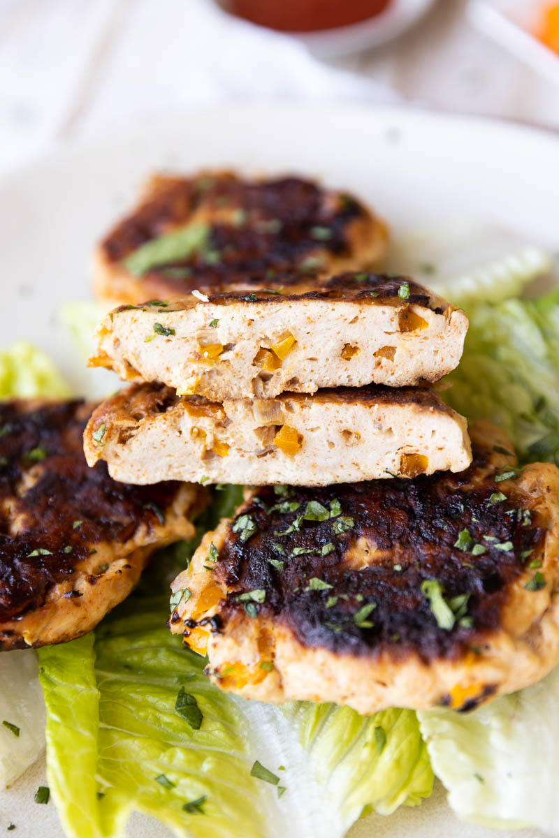 Spicy chicken burger cut in half.