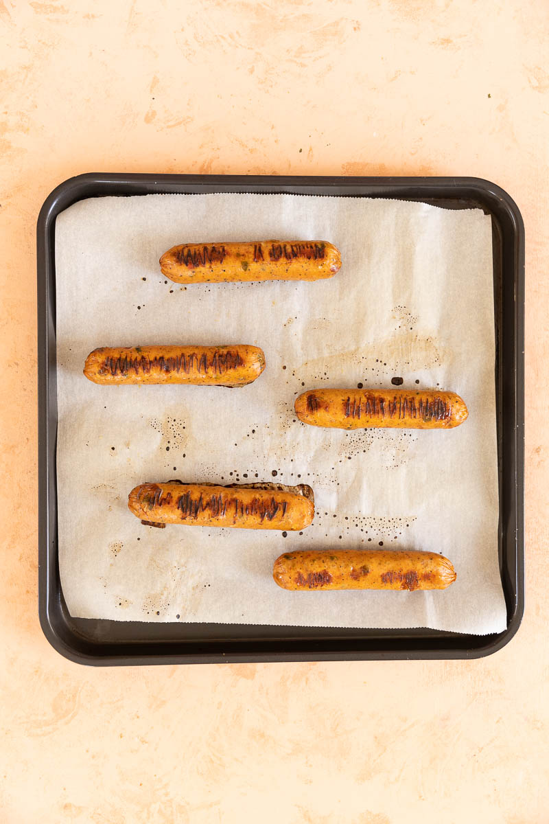 Air fried chicken sausage on a baking tray.