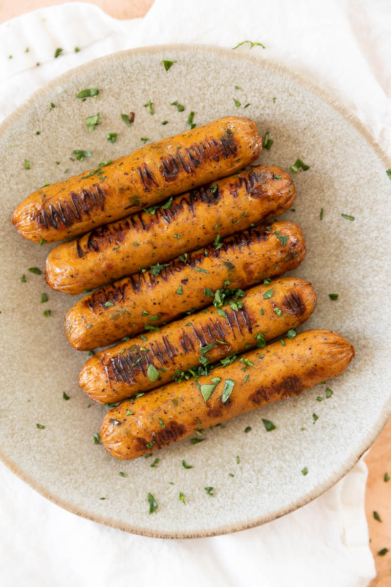 Crispy chicken sausage on a plate.