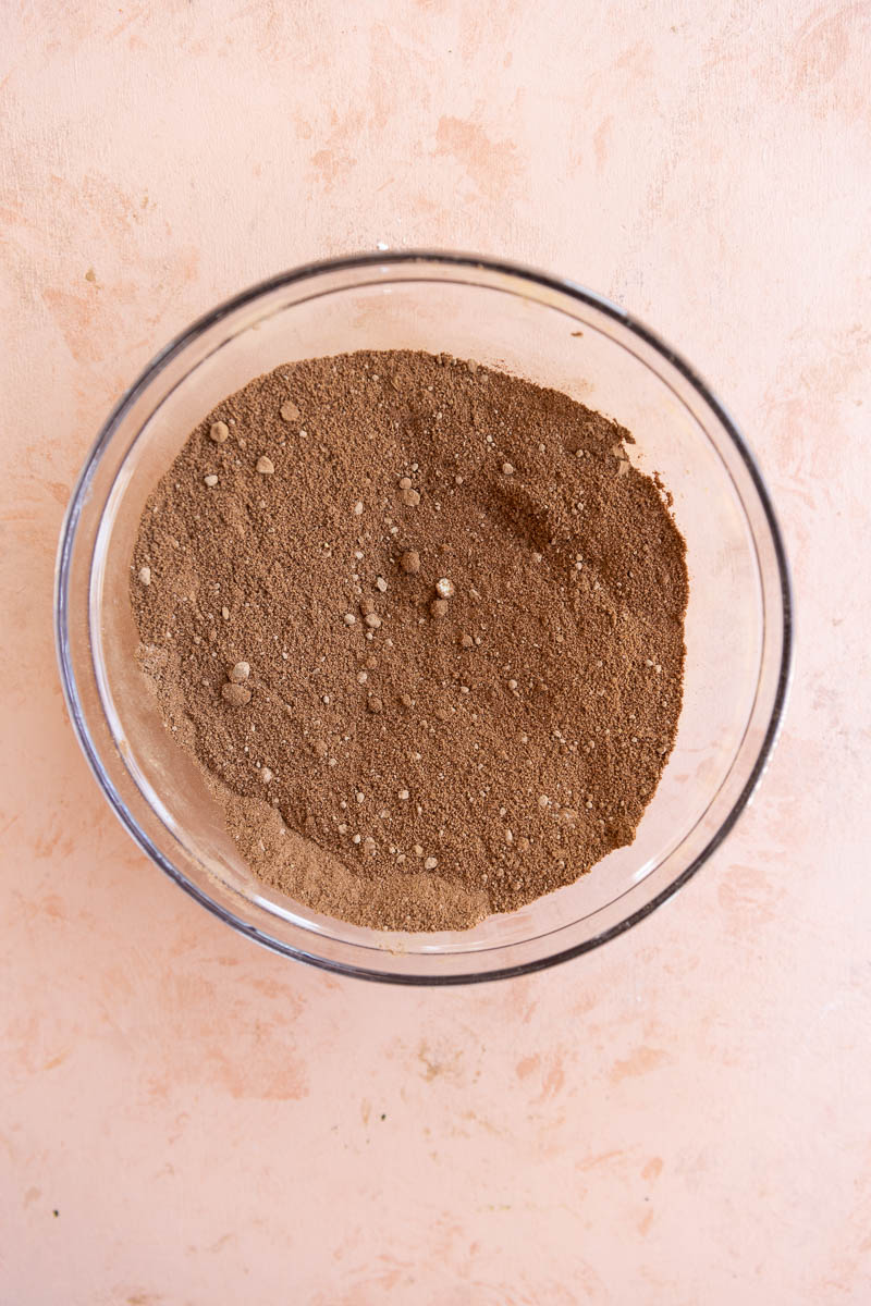 Dry ingredients in a glass mixing bowl.