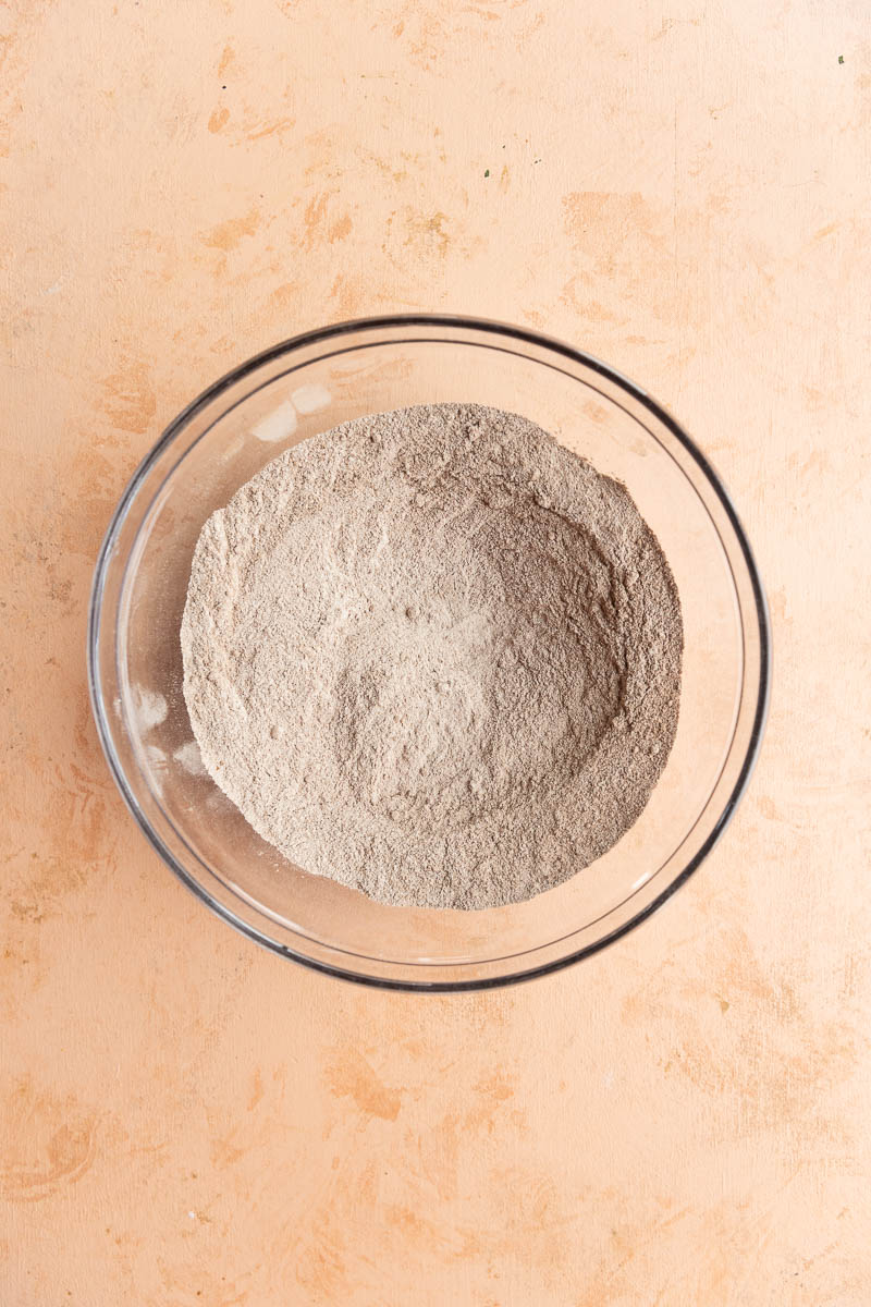 Dry ingredients in a glass mixing bowl.
