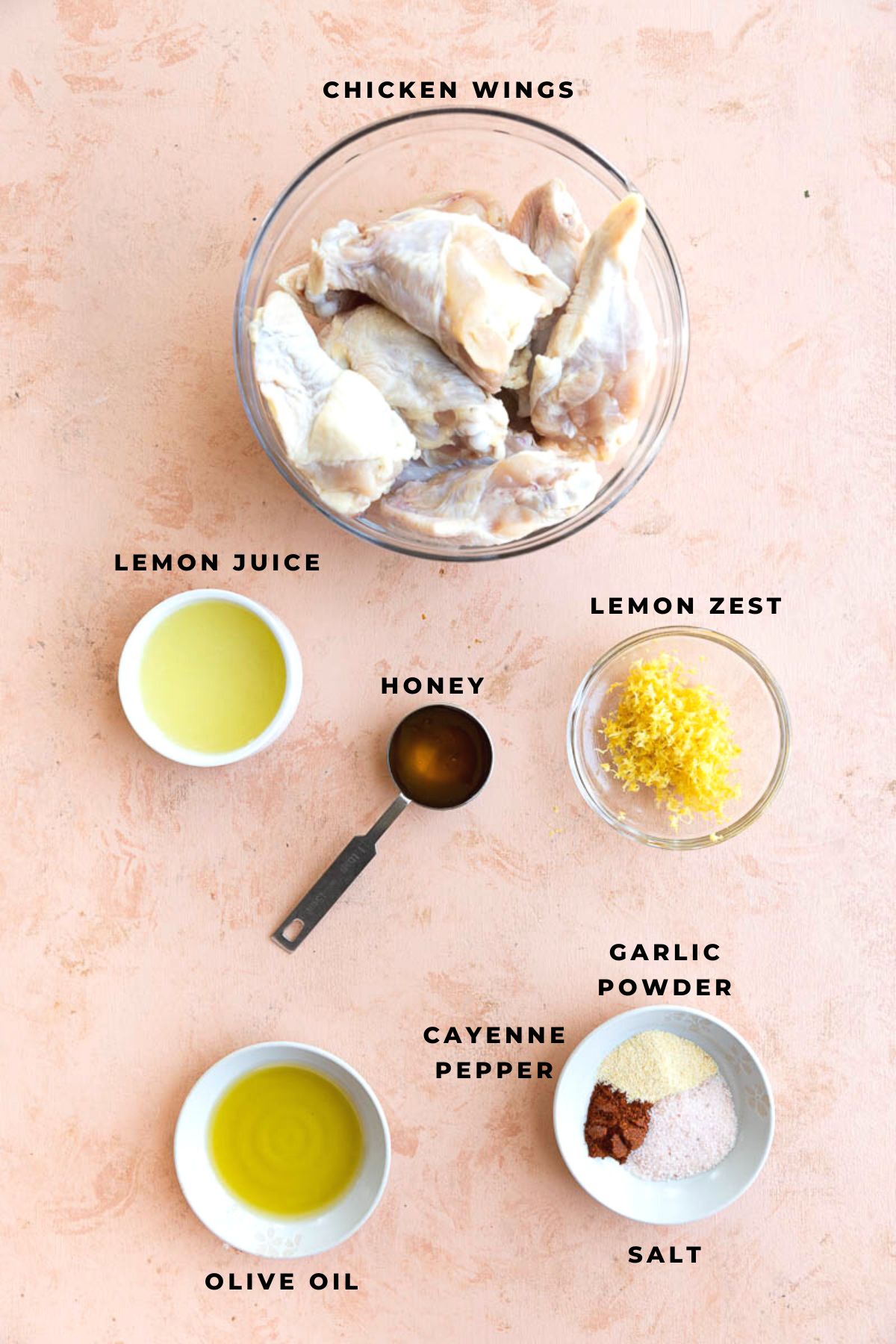 Ingredients measured out into small bowls for honey lemon pepper wing recipe.