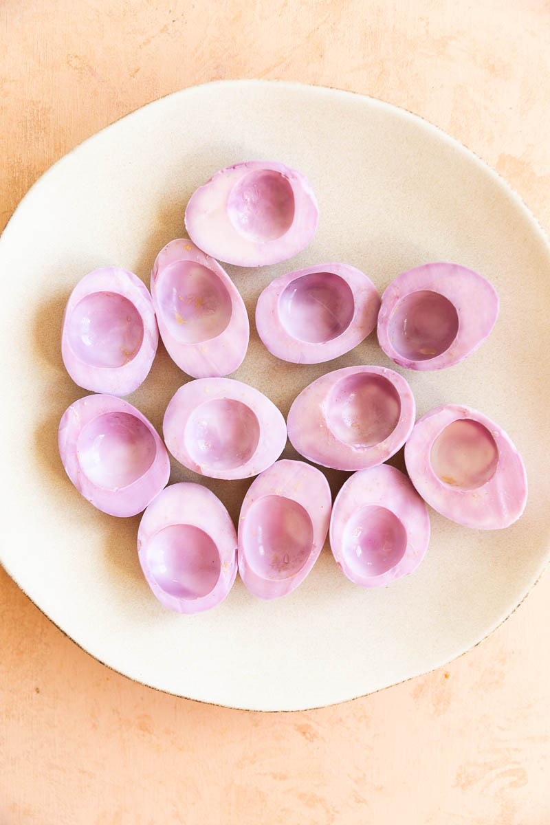 Rinsed pink eggs on a plate.
