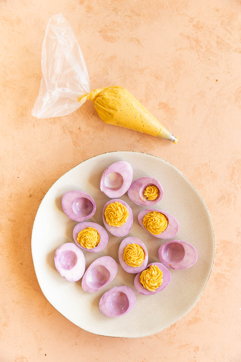 Deviled eggs with piping bag.