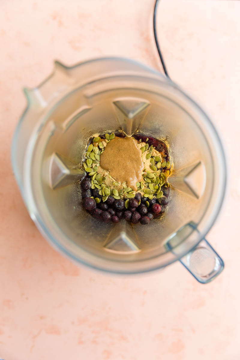 Ingredients for blueberry protein shake in blender.