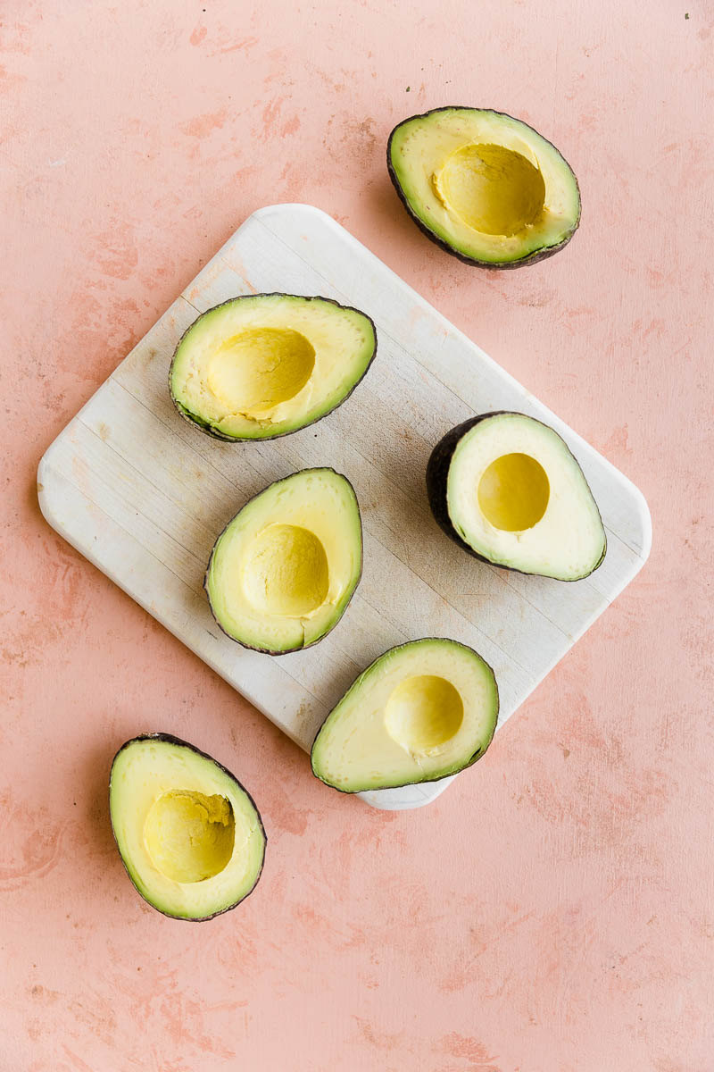 Avocados cut in half.