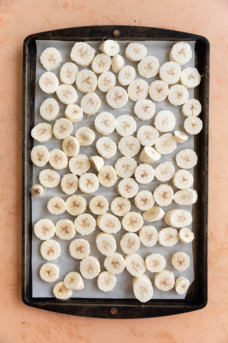 Frozen green bananas on a tray.