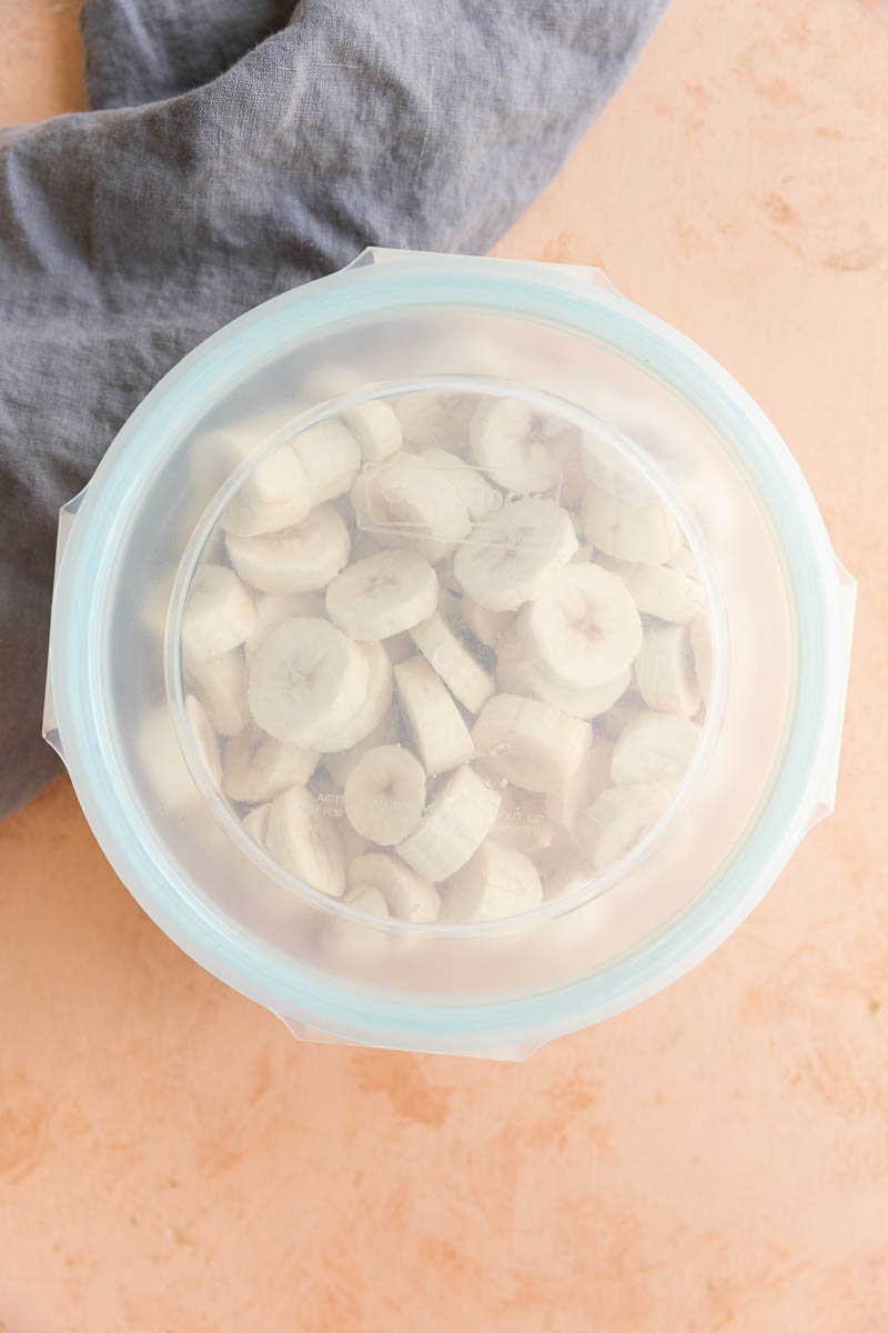 Banana discs in covered glass airtight container.