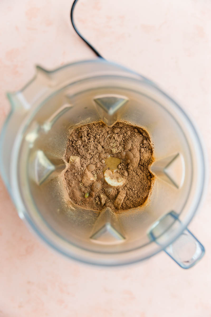 Chocolate protein shake ingredients in blender.