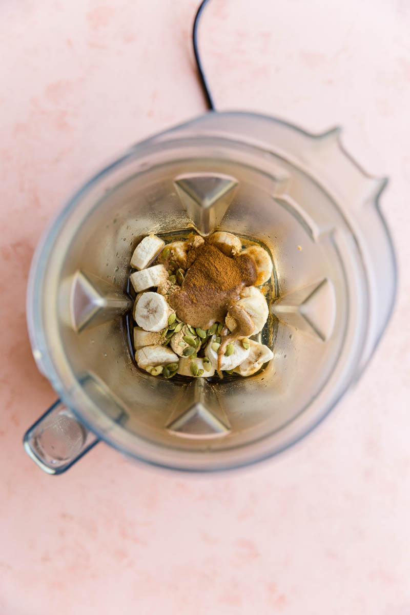 Ingredients for cinnamon roll smoothie in blender.