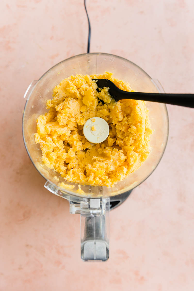 Frozen peaches half mixed in a food processor.