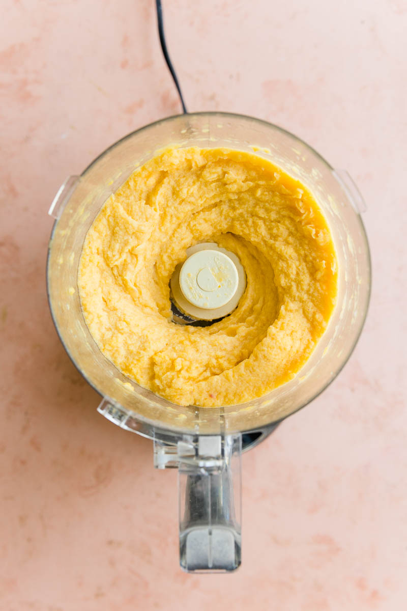 Peach sorbet blended in a food processor.