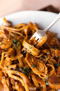 Spaghetti twirled on a fork.