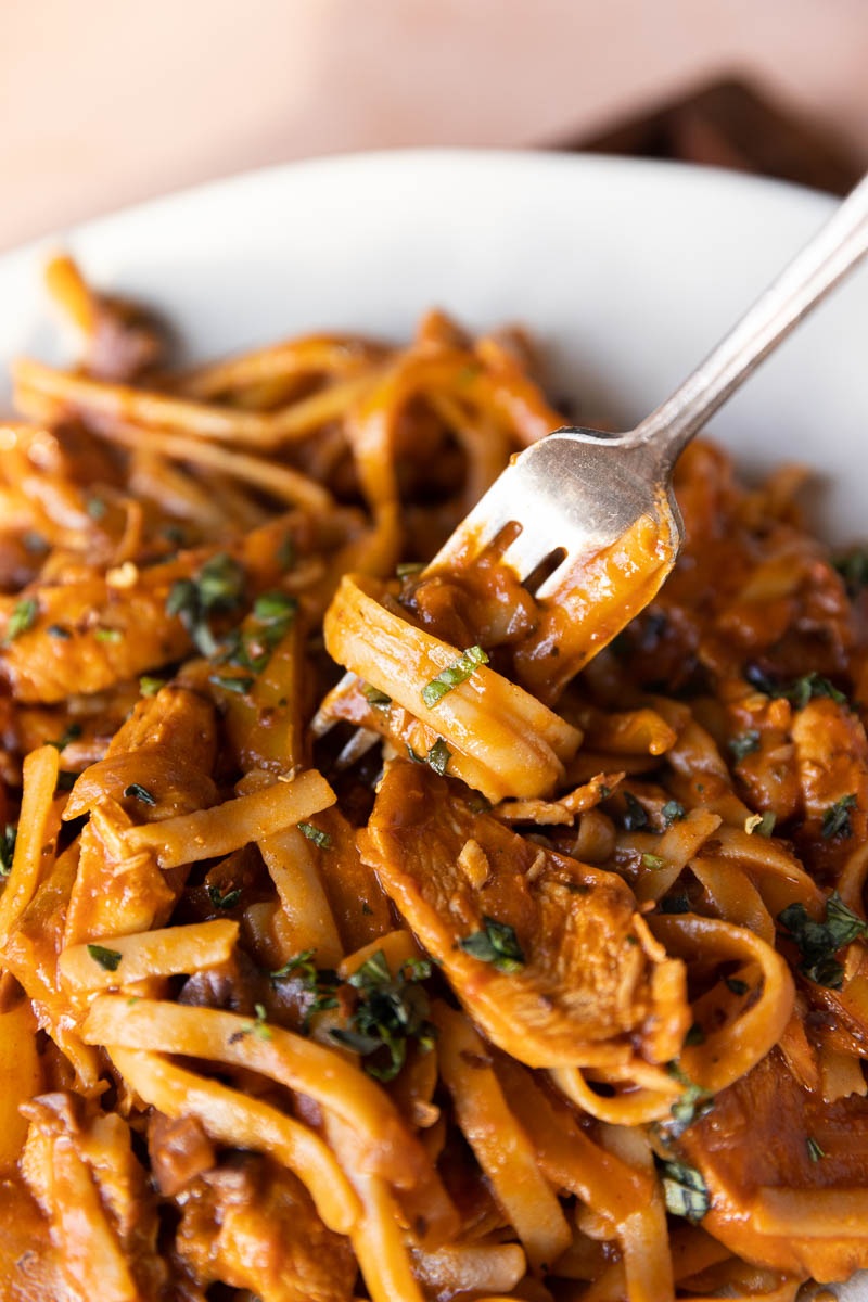 Spaghetti twirled on a fork.