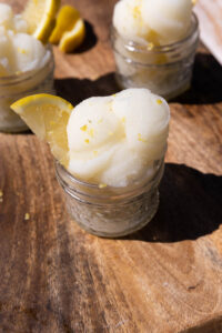 Lemon sorbet in a mini glass mason jar.