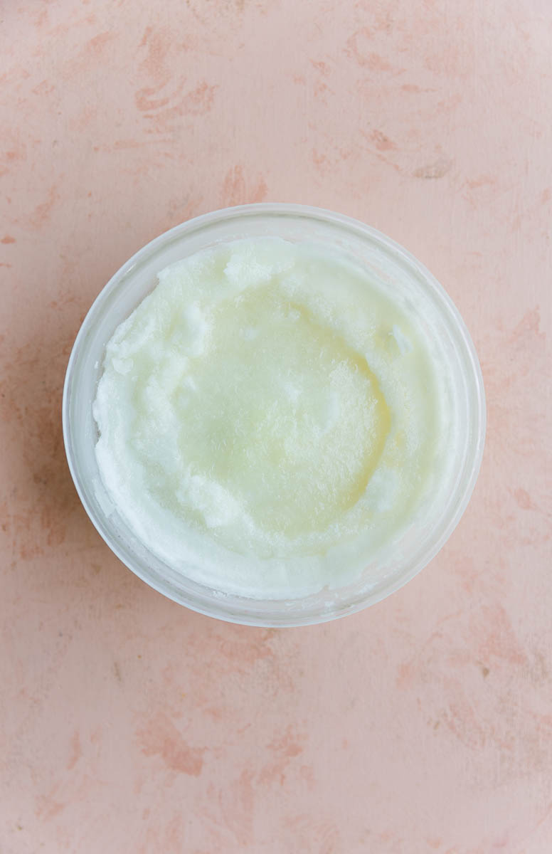 Frozen lime sorbet in glass tupperware.