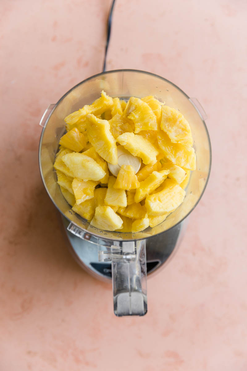 Frozen pineapple in a food processor.