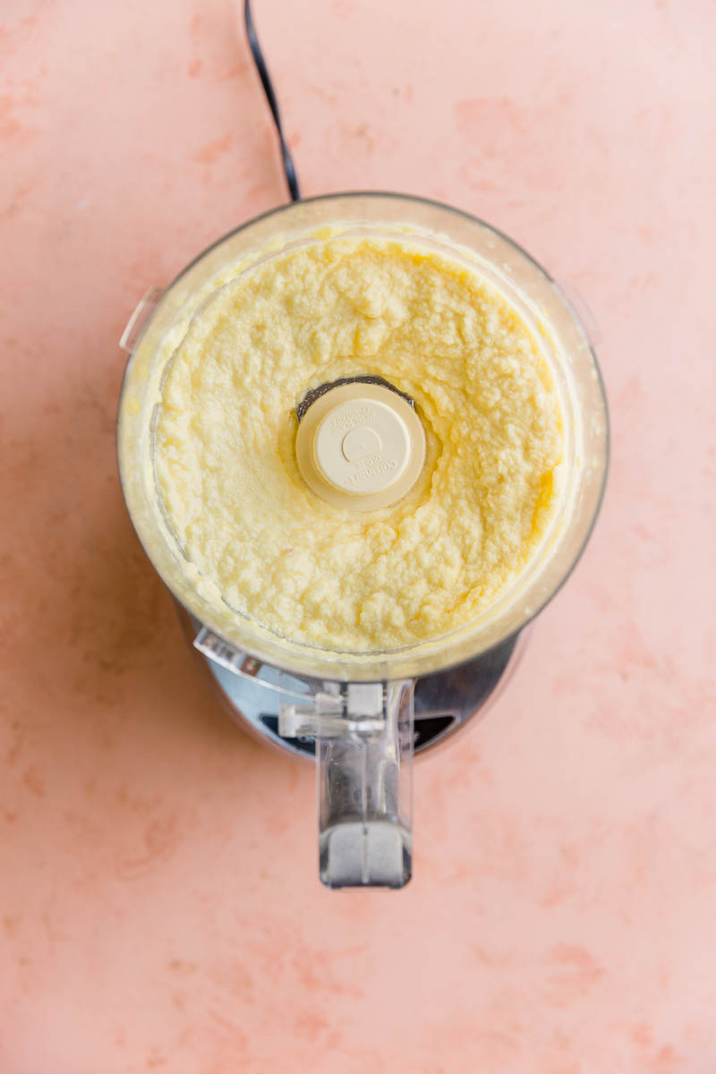 Creamy pineapple sorbet in food processor.