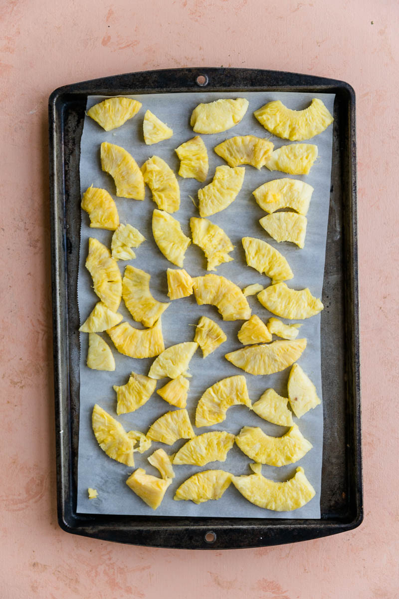 Frozen pineapple on a baking tray.