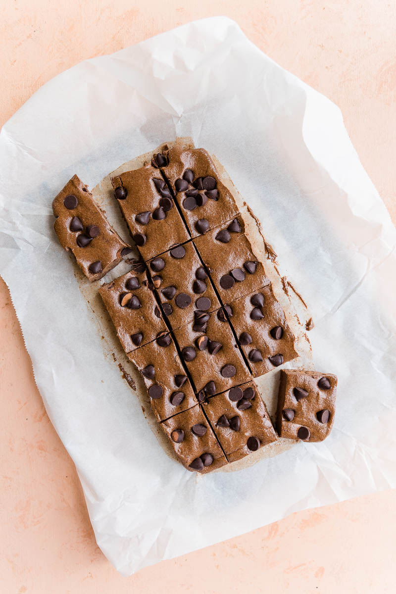 12 protein bars cut on parchment paper.
