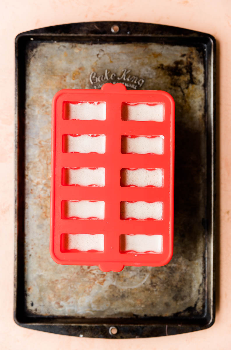 Coffee mixture poured into silicone popsicle mold.