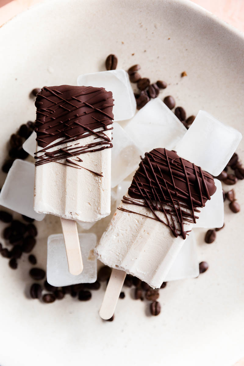 Coffee popsicles on ice cubes.