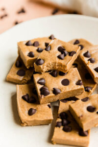 Cookie dough protein bars with a bite taken out of one.