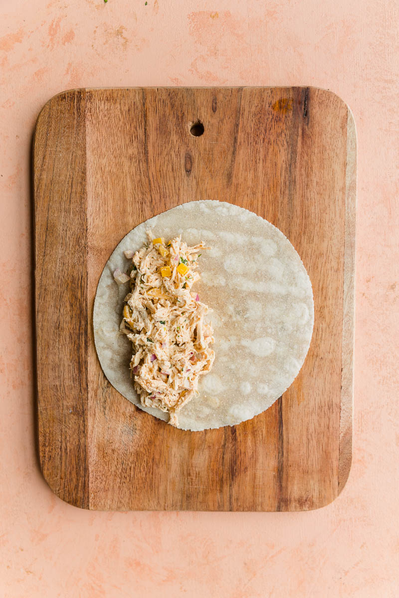 Taquito filling mixture in wrap.
