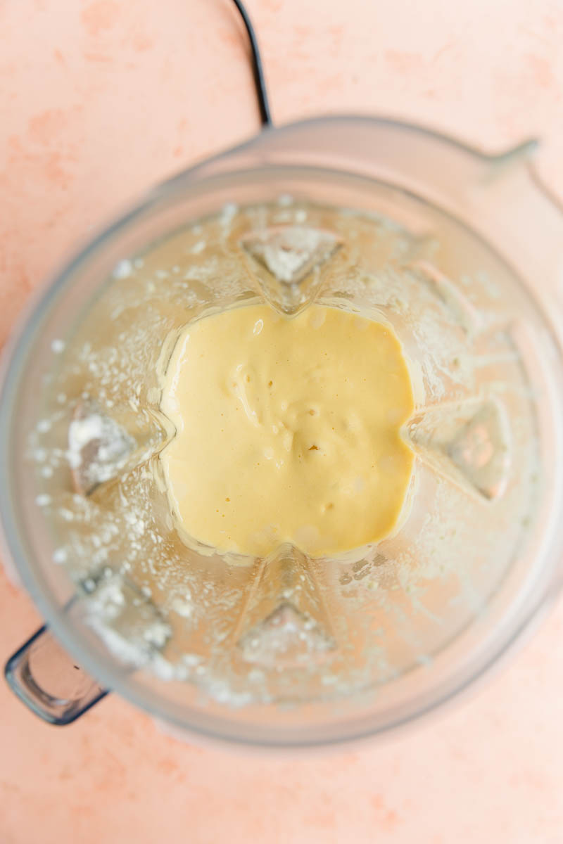 Creamy mango smoothie in blender.