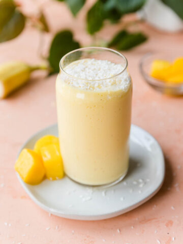 Mango protein shake on a plate.