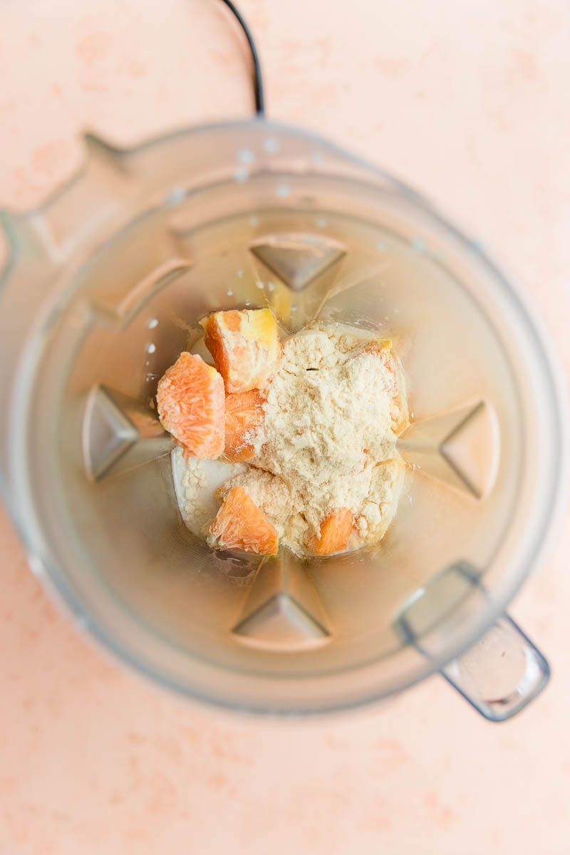 Orange creamsicle ingredients in blender.