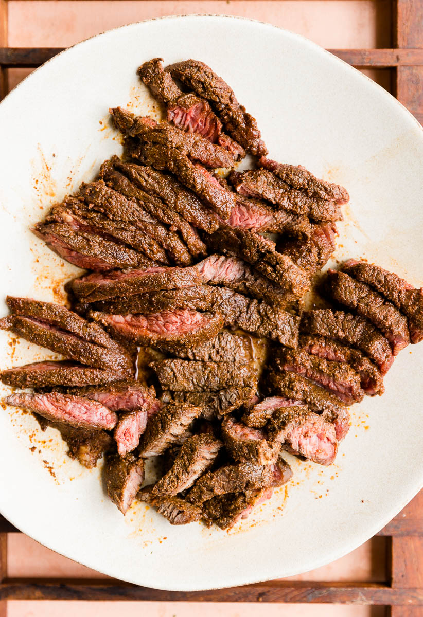 Cooked steak cut on a plate.