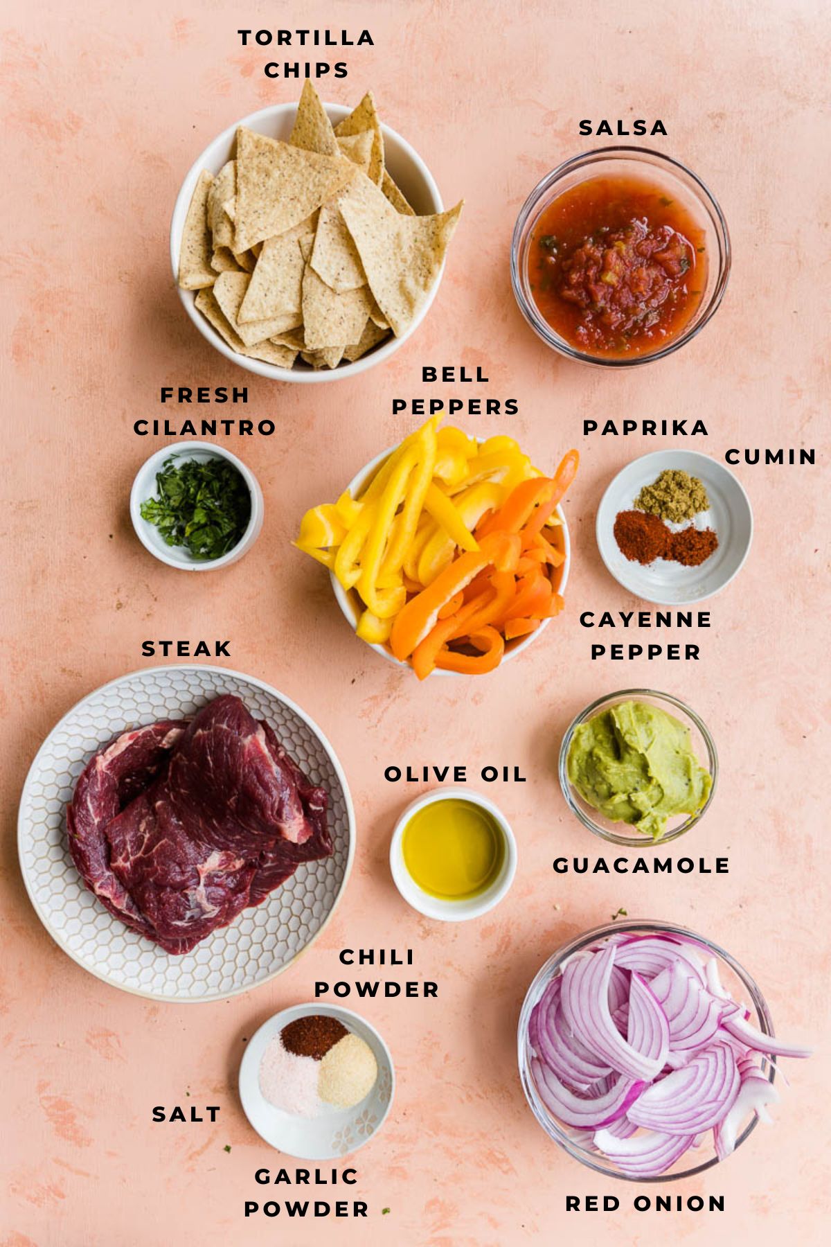 Ingredients measured out for steak fajita nachos.