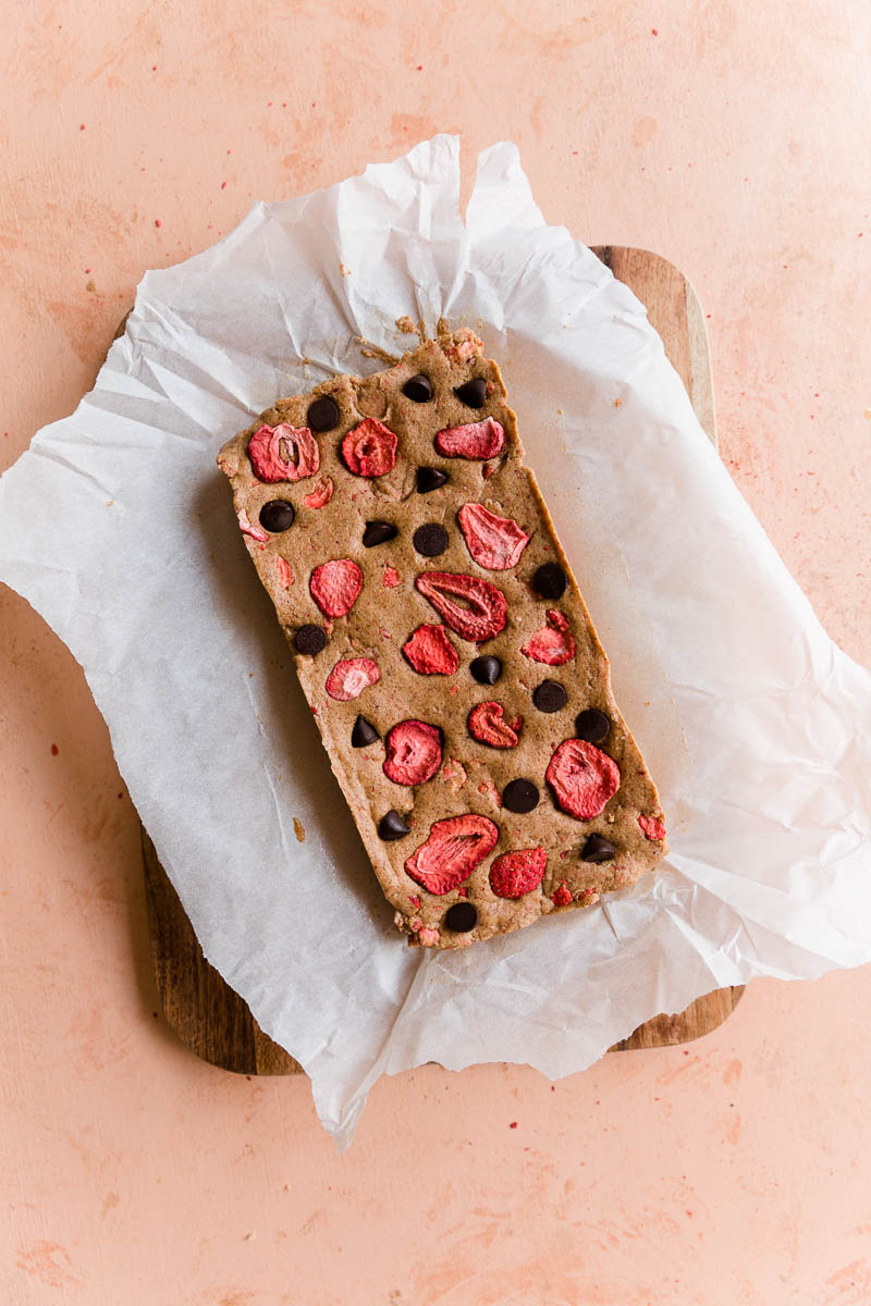 Strawberry protein bar mixture on parchment paper.