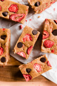 Strawberry protein bars with dark chocolate chips on top.