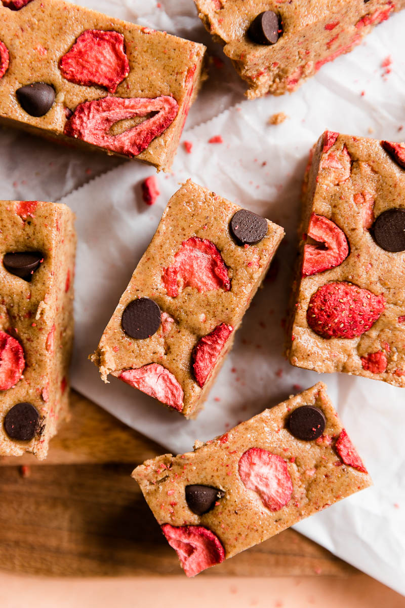Strawberry protein bars with dark chocolate chips on top.