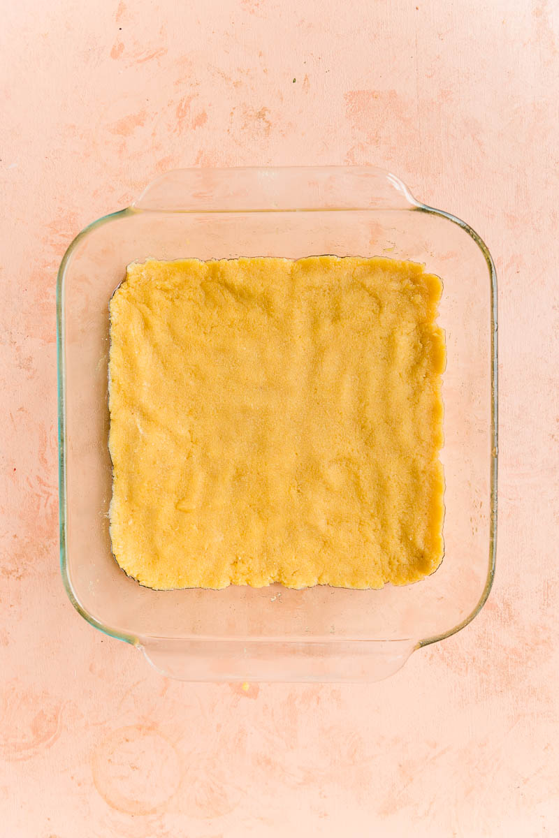 Shortbread crust pressed into glass baking dish.