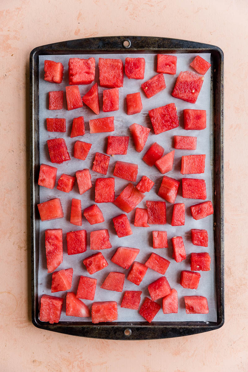 Cubed watermelon on a baking tray.