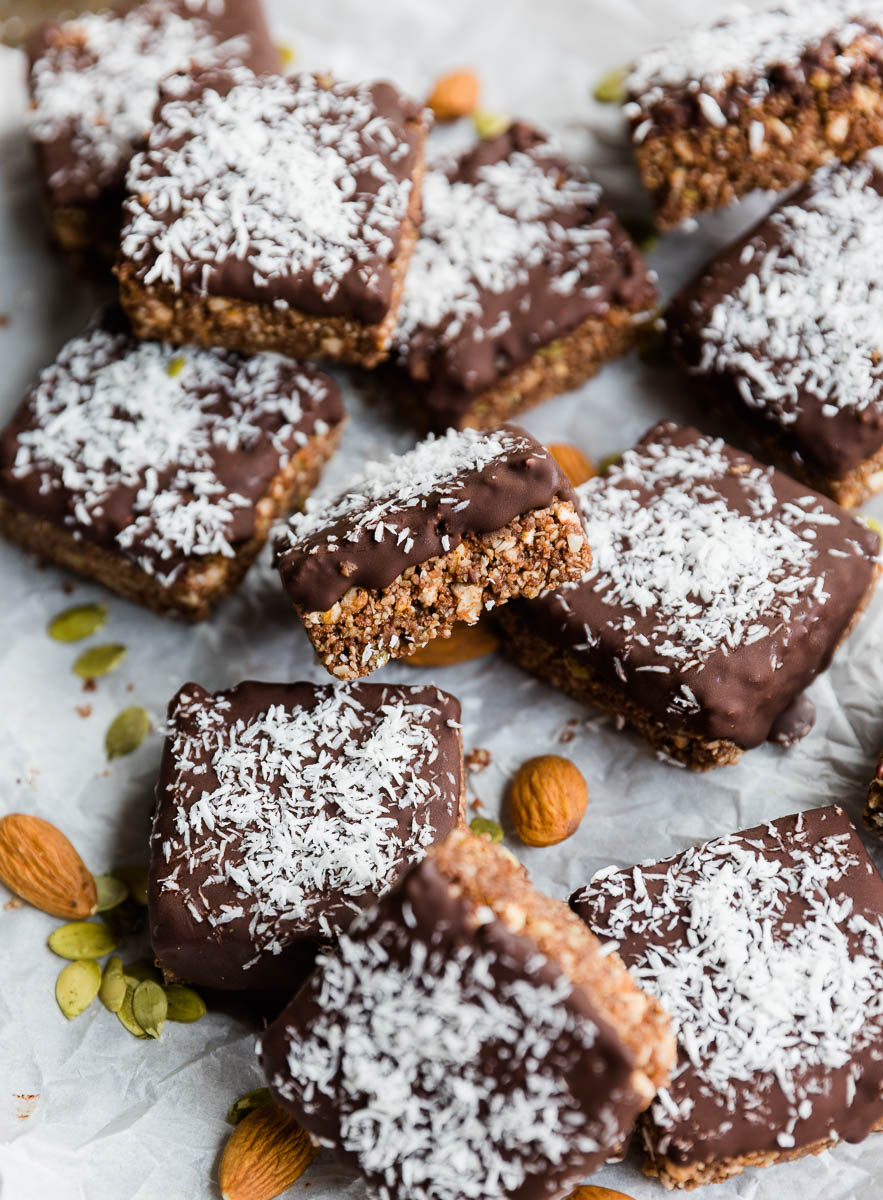 Chocolate energy bars on a parchment paper lined baking sheet.