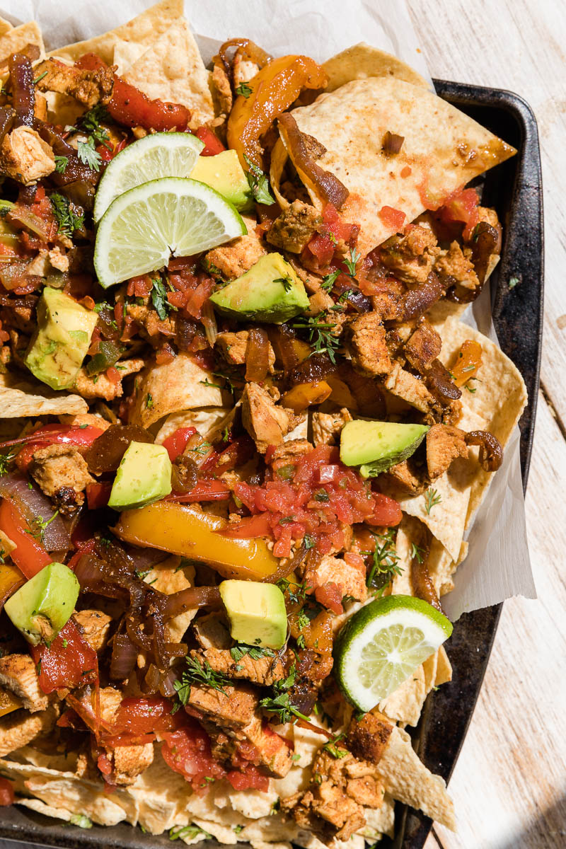 Chicken fajitas on a sheet pan.
