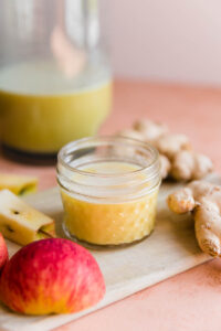 Ginger shot in a small mason jar.