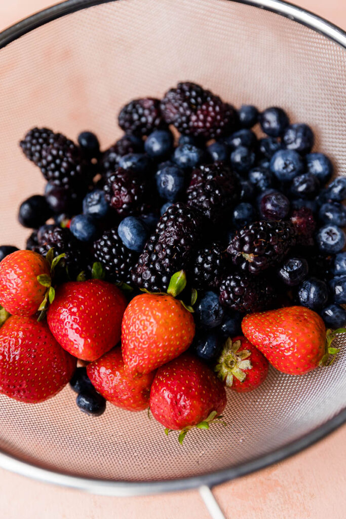 Close up of fresh fruit in strainer.