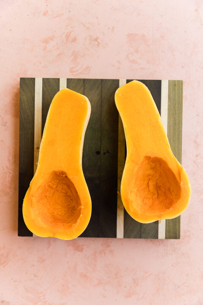 Butternut squash cut in half with seeds cleaned out.