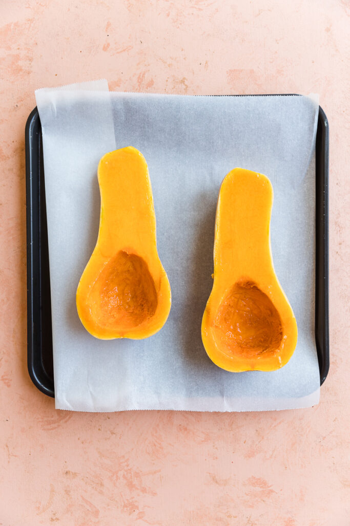 Butternut squash with brushed oil on each half.