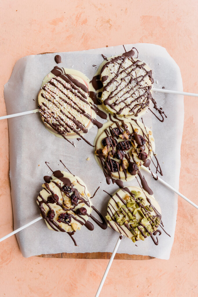 Chocolate covered apple slices with chocolate drizzle.