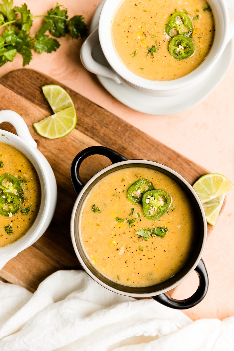 Three bowls of street corn soup with chicken.