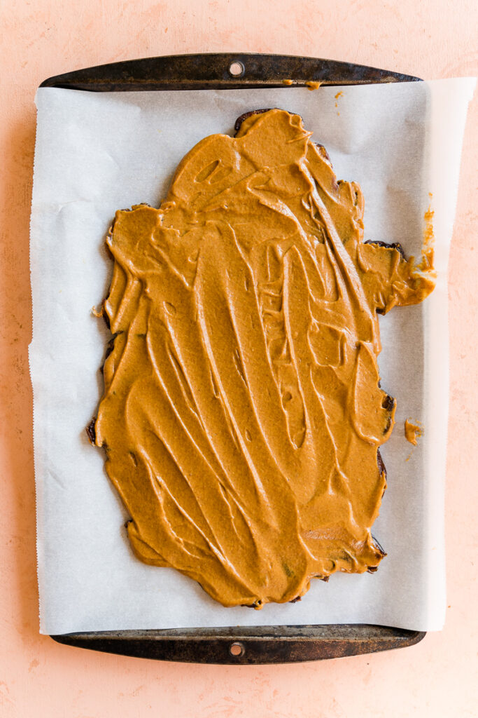 Pumpkin butter spread out onto the date bark.