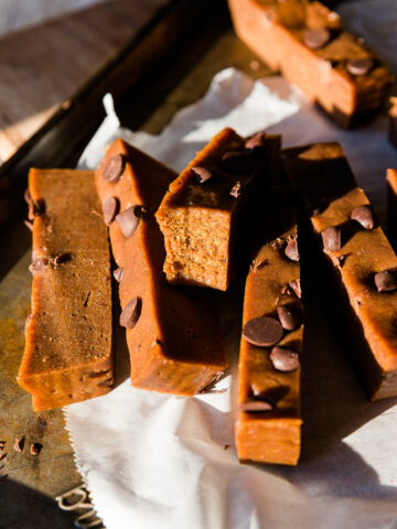Pumpkin protein bar with a bite taken out.